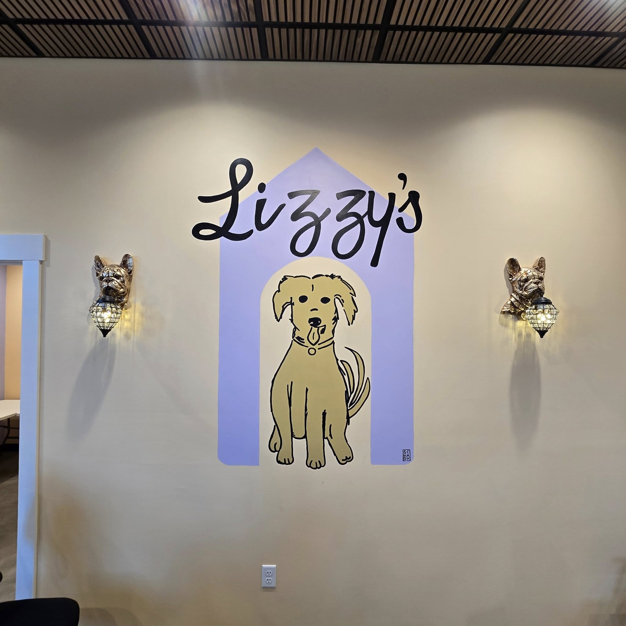 Dogs smiling outside for Lizzys Luxury Lodge